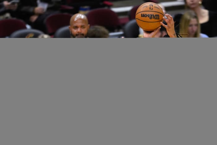 Dec 21, 2023; Cleveland, Ohio, USA; Cleveland Cavaliers forward Emoni Bates (21) shoots as New Orleans Pelicans guard Jordan Hawkins (24) defends in the fourth quarter at Rocket Mortgage FieldHouse.